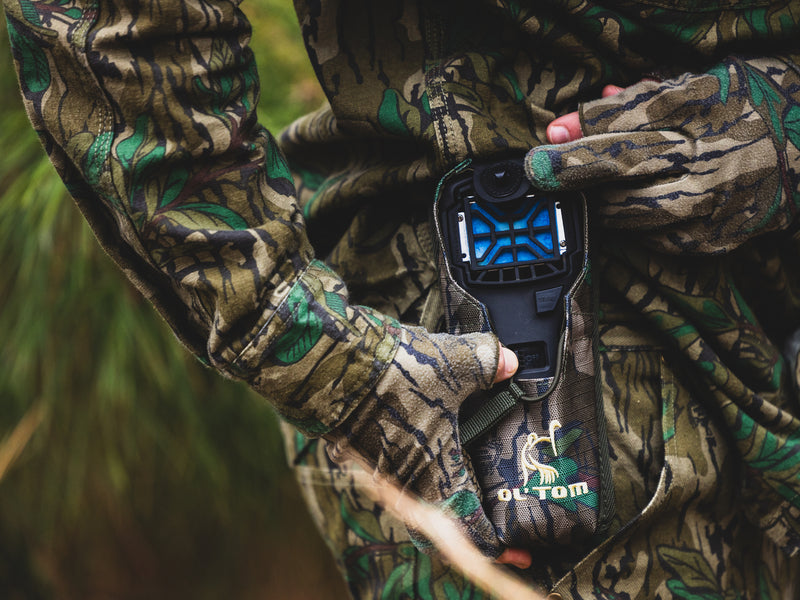 Easy Rider Thermacell Holder with Molle Attachment, held by a person, showcasing its durable Ripstop material and secure loop for outdoor gear attachment.