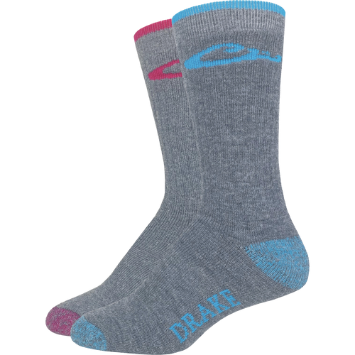 Ladies Merino Wool Blend Boot Sock - 2 Pack features grey socks with blue and pink trim, offering cushioning and arch support for outdoor activities.