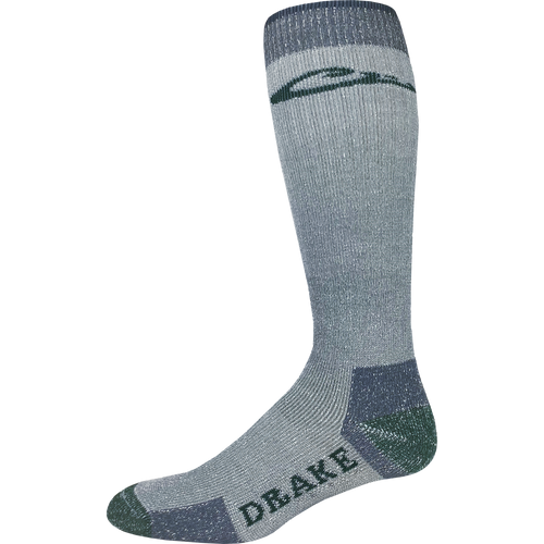 Over-the-Calf Merino Wool Boot Sock featuring full cushioning and reinforced heel and toe for durability, ideal for moisture-wicking and arch support during outdoor activities.