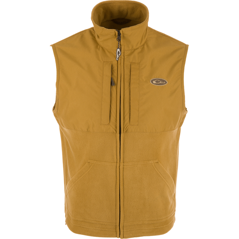 MST Eqwader Vest showcasing upper waterproof fleece and breathable lower polyester, featuring chest Magnattach™ and zippered pockets, designed for hunting efficiency and comfort.