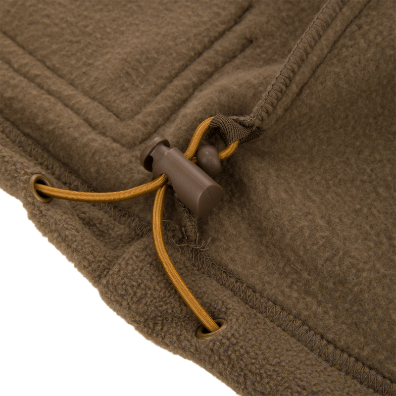 Close-up of MST Eqwader Vest showcasing a detailed view of the zipper and stitching, emphasizing its waterproof upper and breathable fleece lower sections.