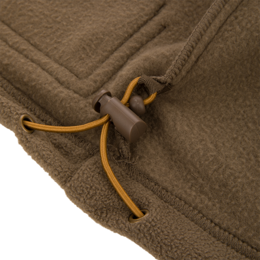Close-up of MST Eqwader Vest showcasing a detailed view of the zipper and stitching, emphasizing its waterproof upper and breathable fleece lower sections.