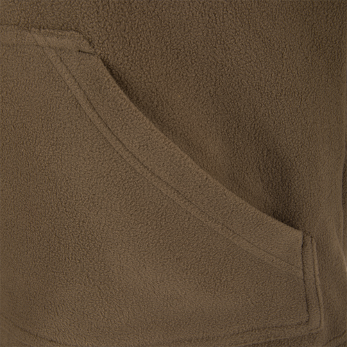 Close-up of MST Eqwader Vest, showcasing its fleece texture, Magnattach™ chest pocket, and zippered pocket for secure storage in hunting conditions.
