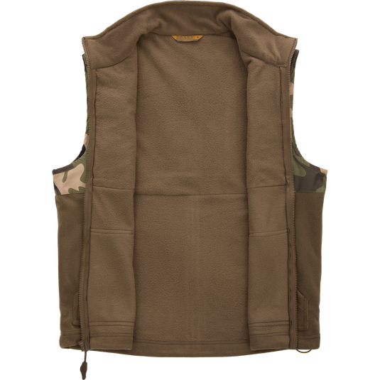 MST Eqwader Vest, featuring camouflage pattern, showcases waterproof, breathable upper with fleece lower, and chest pockets for secure storage, ideal for hunting.