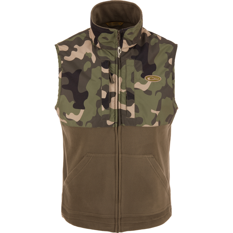 MST Eqwader Vest featuring camouflage design, mid-layer insulation, waterproof shoulders, and breathable fleece lower body, with secure chest pockets for hunting essentials.