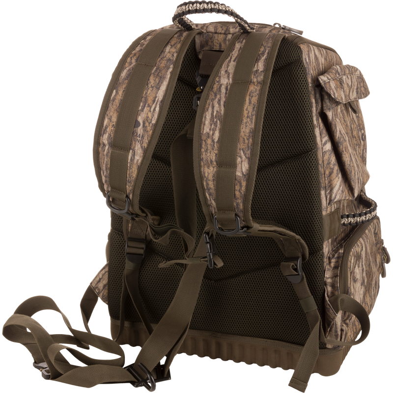 Tree Hugger Timber Pack, featuring a camo design, padded mesh back, adjustable straps, side pockets, ideal for rugged outdoor activities like hunting and hiking.