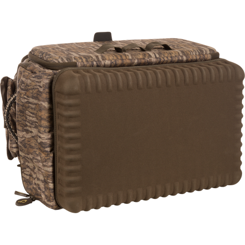 Tree Hugger Timber Pack, a camo-patterned, padded carry bag with molded-foam front, top grab handle, waterproof bottom, and multiple organizational pockets for hunting gear.