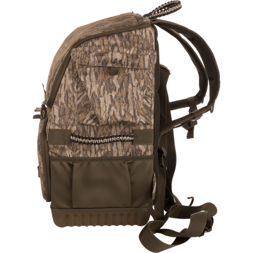 Tree Hugger Timber Pack, camouflage backpack with padded straps, multiple pockets, molded base, webbing loops, and carry handle, designed for co-hunting storage and gear organization.