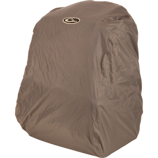Tree Hugger Timber Pack encased in a khaki water-resistant cover with a circular logo on top, showcasing its rugged design for efficient hunting gear storage.