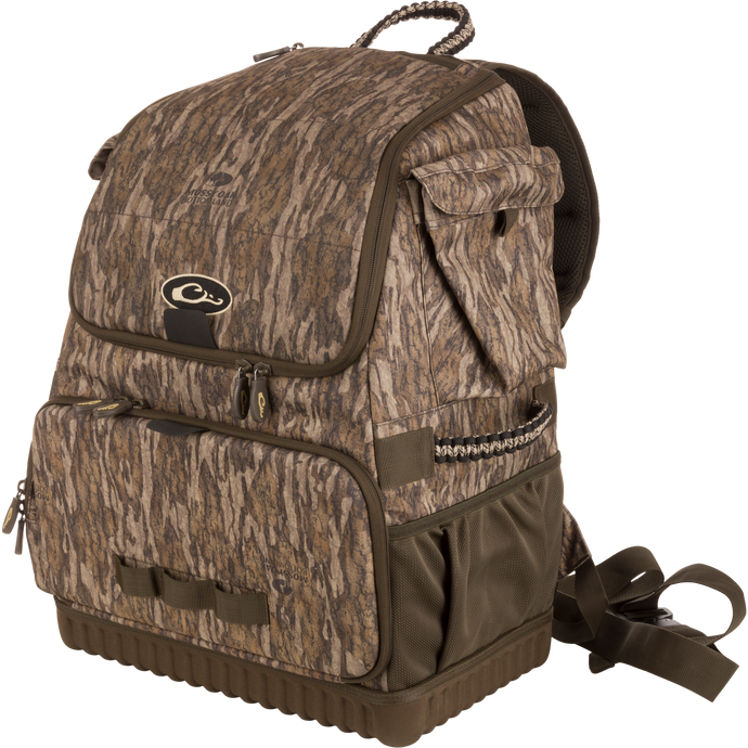 Tree Hugger Timber Pack with camo pattern, multiple zippered compartments, padded straps, molded hard bottom, paracord detailing; ideal for outdoor activities like hunting or fishing.