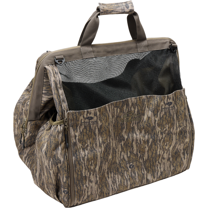 Guardian Elite Wader Bag with camo pattern, mesh panel, padded handles, zippered side pockets, and Mossy Oak/Drake branding, ideal for hunting gear transport.