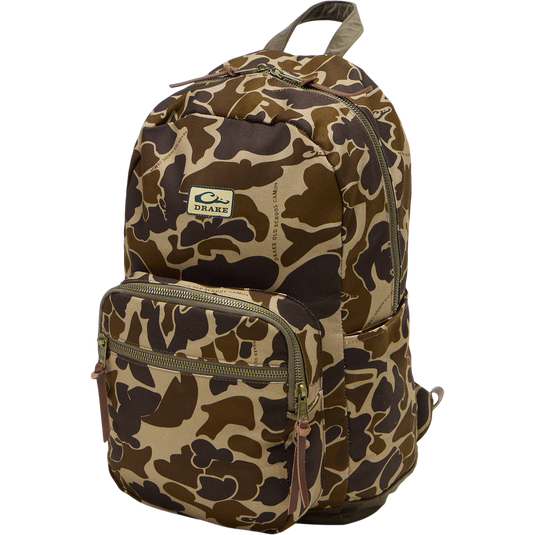 Limited Edition Throwback 80 Backpack, featuring rugged canvas, suede bottom, sturdy cotton webbing, antique bronze buckles, and large zippers, perfect for durable hauling.