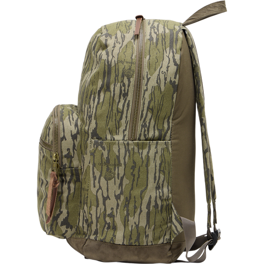 Close-up of the Limited Edition Throwback 80 Backpack featuring rugged cotton canvas, suede reinforcement, durable webbing, and antique bronze hardware, ideal for outdoor adventures.