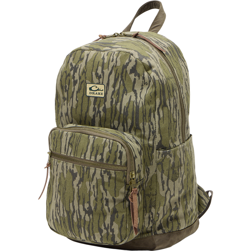 Limited Edition Throwback 80 Backpack, featuring rugged 100% cotton canvas, suede bottom, antique bronze buckles, and 25L capacity, perfect for durable hauling needs.