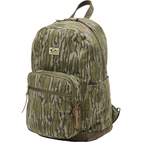 Limited Edition Throwback 80 Backpack, featuring rugged 100% cotton canvas, suede bottom, antique bronze buckles, and 25L capacity, perfect for durable hauling needs.