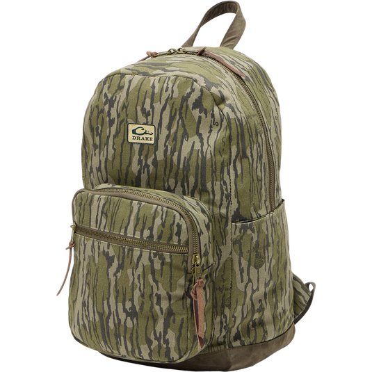 Limited Edition Throwback 80 Backpack, featuring rugged 100% cotton canvas, suede bottom, antique bronze buckles, and 25L capacity, perfect for durable hauling needs.