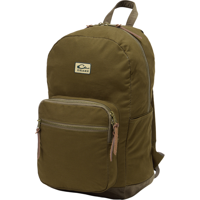 Limited Edition Throwback 80 Backpack with durable cotton canvas, suede bottom, and antique bronze buckles, ideal for rugged outdoor adventures and extensive hauling needs.