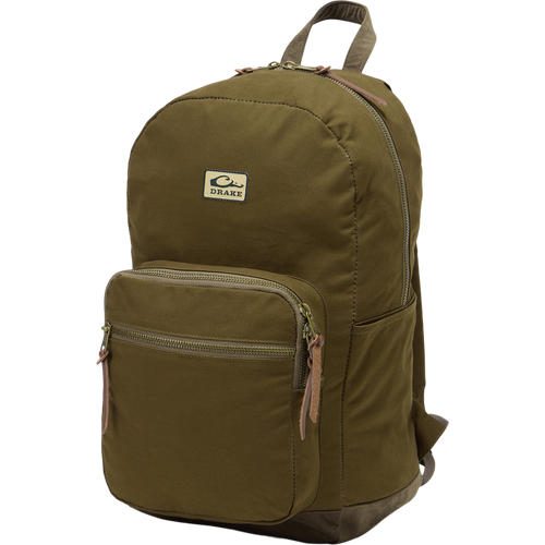 Limited Edition Throwback 80 Backpack with durable cotton canvas, suede bottom, and antique bronze buckles, ideal for rugged outdoor adventures and extensive hauling needs.