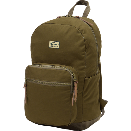 Limited Edition Throwback 80 Backpack with durable cotton canvas, suede bottom, and antique bronze buckles, ideal for rugged outdoor adventures and extensive hauling needs.