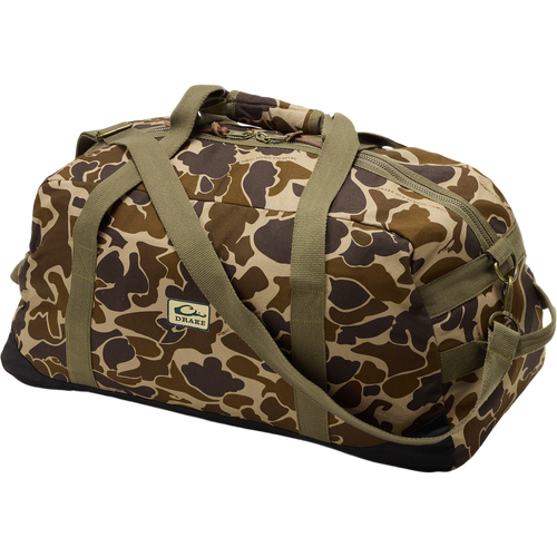 Throwback 80 Duffle Bag, a durable camouflage bag with sturdy cotton straps, suede bottom, and antique bronze buckles, ideal for outdoor adventures.