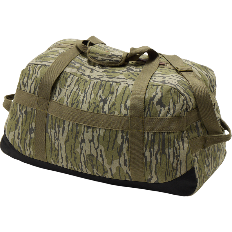 Throwback 80 Duffle Bag close-up, showcasing durable cotton canvas, suede bottom, and rugged bronze buckles, perfect for adventurous hunting and outdoor pursuits.