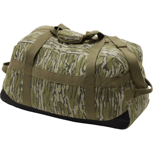 Throwback 80 Duffle Bag close-up, showcasing durable cotton canvas, suede bottom, and rugged bronze buckles, perfect for adventurous hunting and outdoor pursuits.