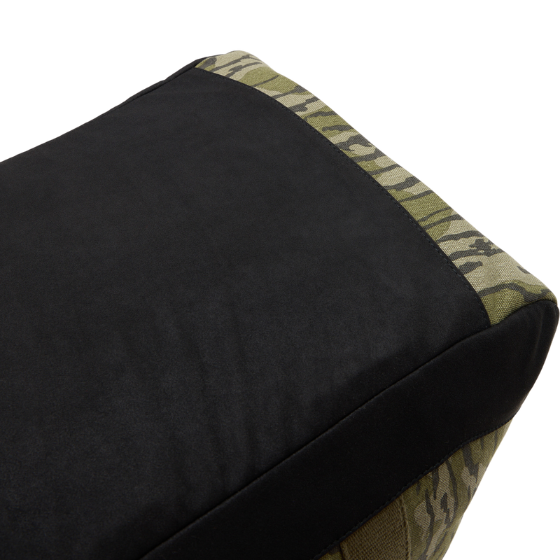 Throwback 80 Duffle Bag close-up showing its durable cotton canvas and suede bottom with antique bronze buckles, ideal for rugged adventures.