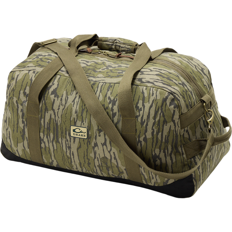 Throwback 80 Duffle Bag close-up showing rugged metal zipper and logo, highlighting durable cotton canvas and suede reinforcement for hunting and adventure gear.