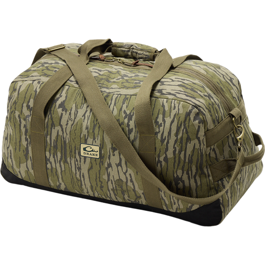 Throwback 80 Duffle Bag close-up showing rugged metal zipper and logo, highlighting durable cotton canvas and suede reinforcement for hunting and adventure gear.
