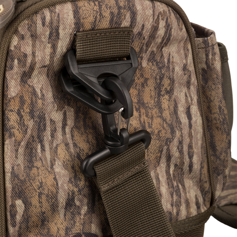 Tree Hugger Shoulder Bag with camo-pattern, featuring adjustable webbing strap, swivel hook, and durable foam hardshell for outdoor hunting gear from Purewhitelaneshop.