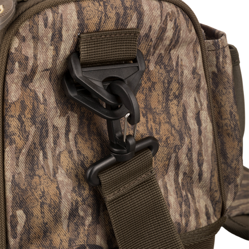 Tree Hugger Shoulder Bag with camo-pattern, featuring adjustable webbing strap, swivel hook, and durable foam hardshell for outdoor hunting gear from Purewhitelaneshop.