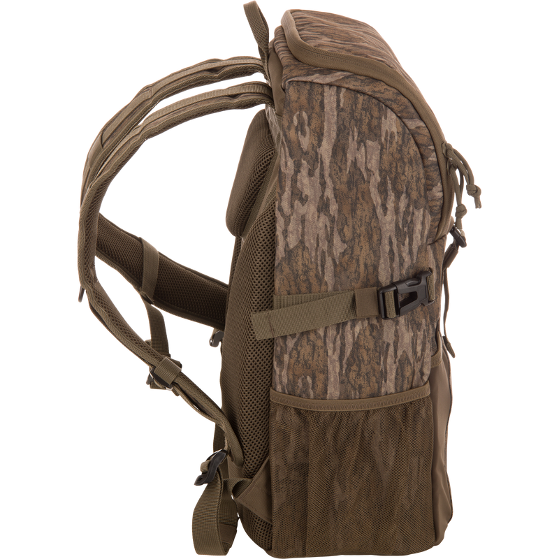 Drake Day Pack in camouflage, featuring padded shoulder straps, mesh side pockets, and compression straps, ideal for outdoor adventures with rugged, water-resistant construction.