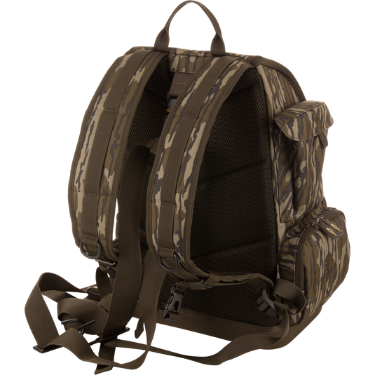 Back view of the Tree Hugger Timber Day Pack with padded straps, mesh panel, waist belt, side zippered pockets, and top handle, ideal for rugged outdoor excursions.