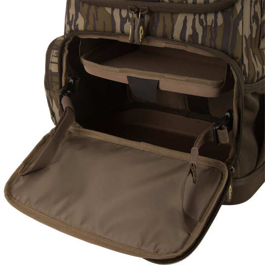 Tree Hugger Timber Day Pack with open front compartment, showing padded shelf and empty storage, designed for outdoor excursions with rugged, water-resistant features.