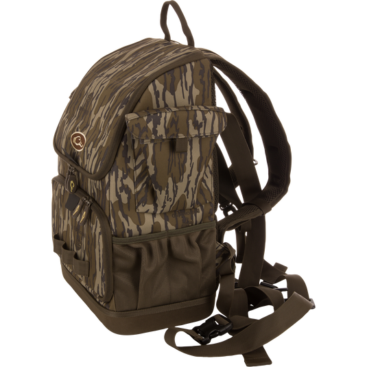 Camouflage-patterned Tree Hugger Timber Day Pack with multiple pockets, padded straps, and waterproof features, designed for outdoor excursions and hunting gear storage.