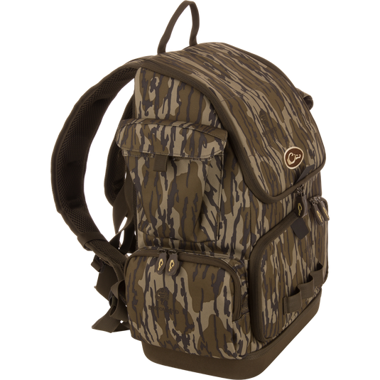 Tree Hugger Timber Day Pack with padded straps, multiple compartments, floatable hardshell, waterproof base, and quick-access pockets, ideal for outdoor excursions and hunting.