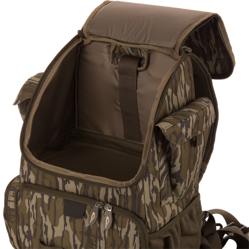 Tree Hugger Timber Day Pack with open main compartment, side pouches, front zip pocket, adjustable straps, showcasing its rugged, water-resistant design for outdoor adventures.