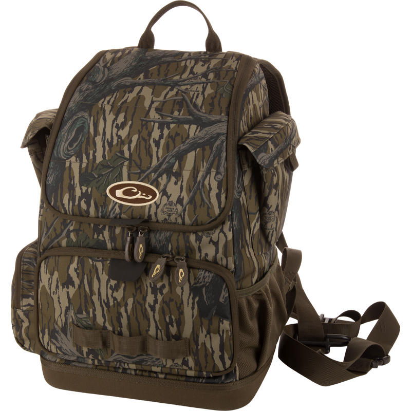 Tree Hugger Timber Day Pack with woodland camo, multiple pockets, rugged HD2™ material, waterproof bottom, and adjustable straps, ideal for outdoor hunting and fishing.