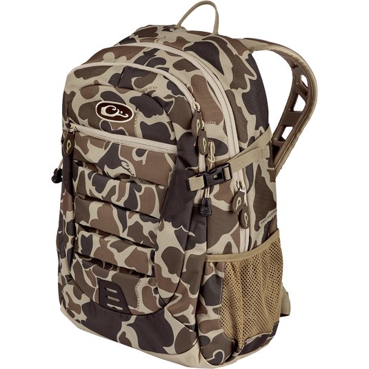 Youth Camo Daypack featuring a rugged design with padded straps, large zippered storage, and hydration pockets, suitable for casual and hunting use.
