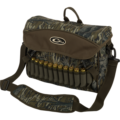 A black Shoulder Bag 2.0 with ammunition and logo. Features adjustable strap, storage pockets, and durable hardware. Ideal for guides and outfitters.