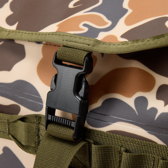 Waterproof Duffel Bag's camo flap with olive strap and side-release buckle, highlighting durability and secure closure for hunting and outdoor adventures.