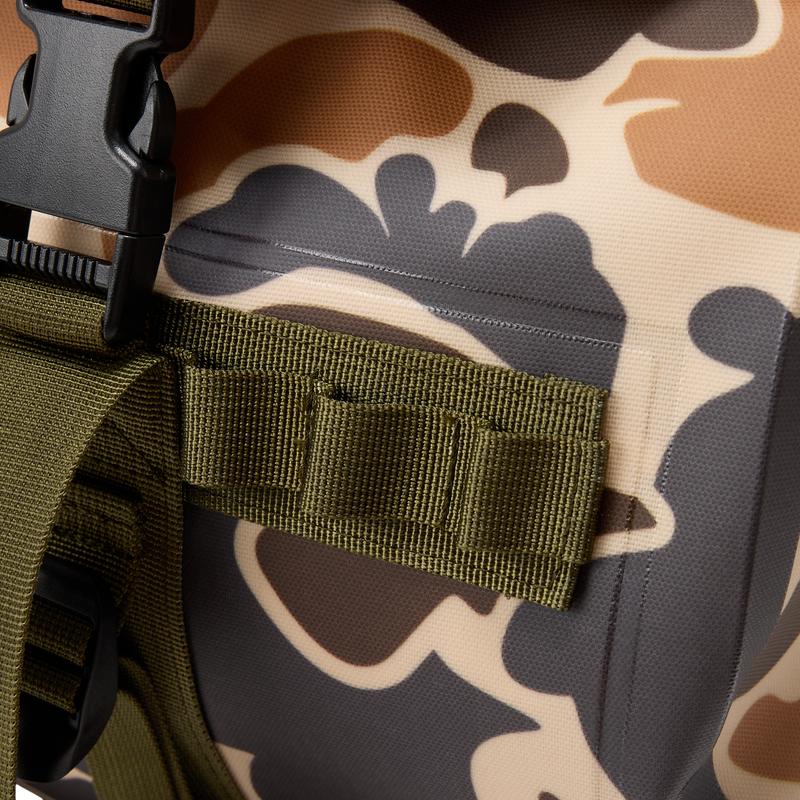 Close-up of a Waterproof Duffel Bag showing camo fabric, MOLLE loops, and black buckle, highlighting its durability and tactical design.