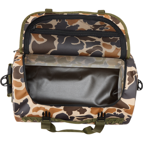Waterproof Duffel Bag with camo pattern, open to show empty main compartment and zippered mesh pocket under lid; features durable handles and front plastic buckles.