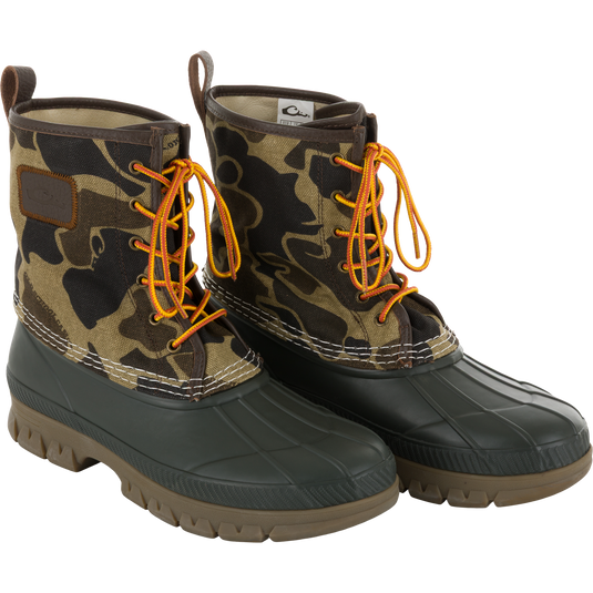 Throwback 80 Waxed Canvas Lace Up Duck Boot with camo-patterned canvas upper, waterproof rubber bottom, and bright laces, designed for durability and comfort in rugged outdoor conditions.