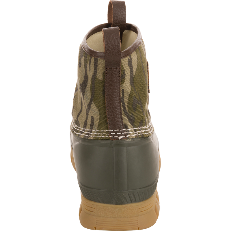 Throwback 80 Waxed Canvas Slip On Duck Boot features a camo-patterned canvas upper, olive-green waterproof rubber bottom, and brown leather pull tab for durable, water-resistant performance.
