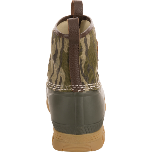 Throwback 80 Waxed Canvas Slip On Duck Boot features a camo-patterned canvas upper, olive-green waterproof rubber bottom, and brown leather pull tab for durable, water-resistant performance.