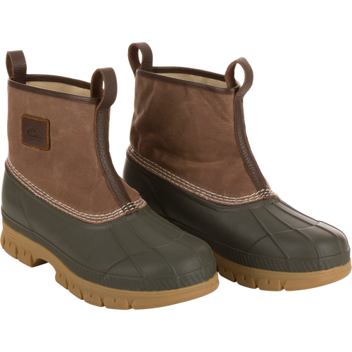 Throwback 80 Waxed Canvas Slip On Duck Boot with rugged waxed canvas upper, premium leather lining, and waterproof rubber bottom, ideal for demanding outdoor environments.