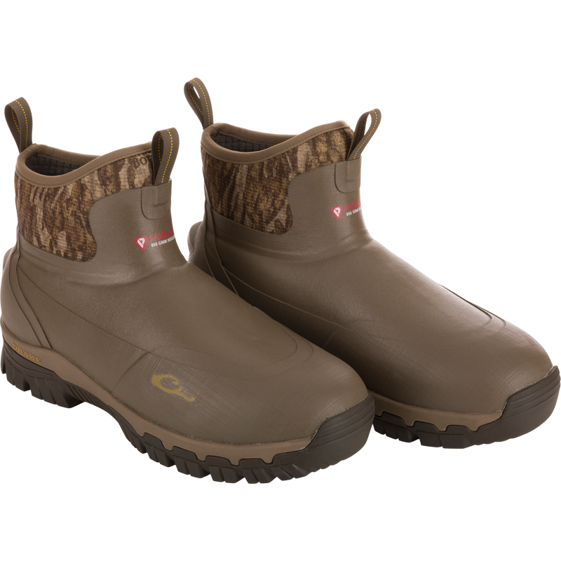 BMF1600 17 Rubber Boot with Primaloft Insulation; slip-on, rugged boots with camo collar, lugged soles, and gusseted back for optimal fit in hunting conditions.