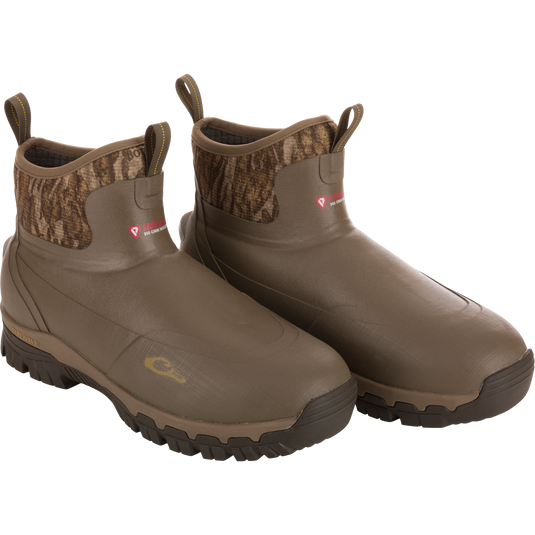 BMF1600 17 Rubber Boot with Primaloft Insulation; slip-on, rugged boots with camo collar, lugged soles, and gusseted back for optimal fit in hunting conditions.