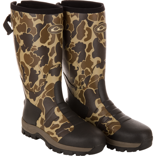 MST 16 Hybrid Mudder Boot 3.0, camo-pattern, rugged Wellington-style with lug soles, ideal for hunting, featuring neoprene, Thinsulate™ insulation, and EVA midsole for comfort.